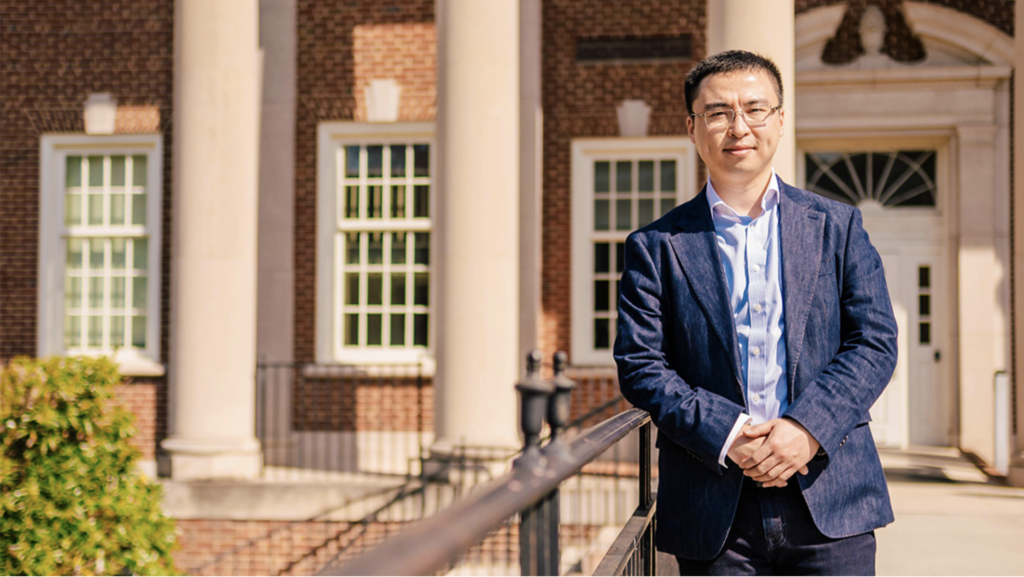 Professor of Computer Science Yingcheng Sun standing outside at UNCG